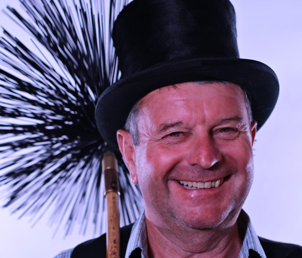 Stuart Withyman with traditional sweeping brushes